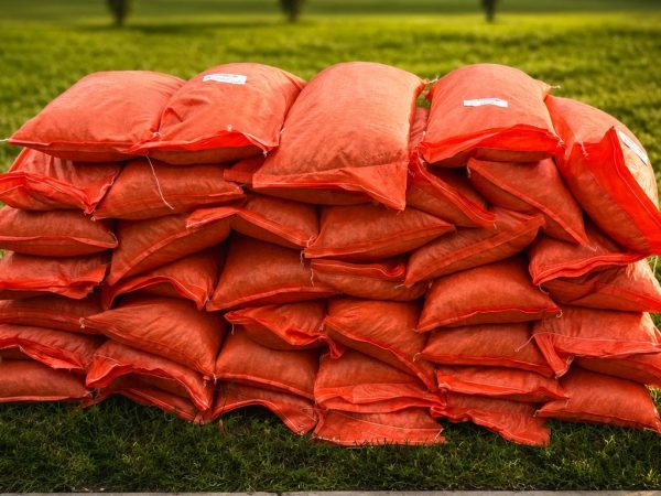 Stacked bags of premium screened pea gravel at Triad Stone Age in Greensboro, NC